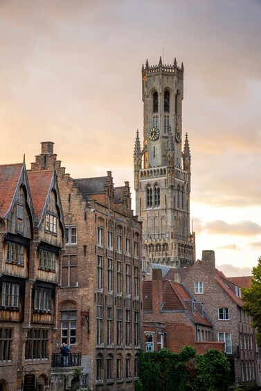 A historic tower with clocks, surrounded by traditional European architecture. 3