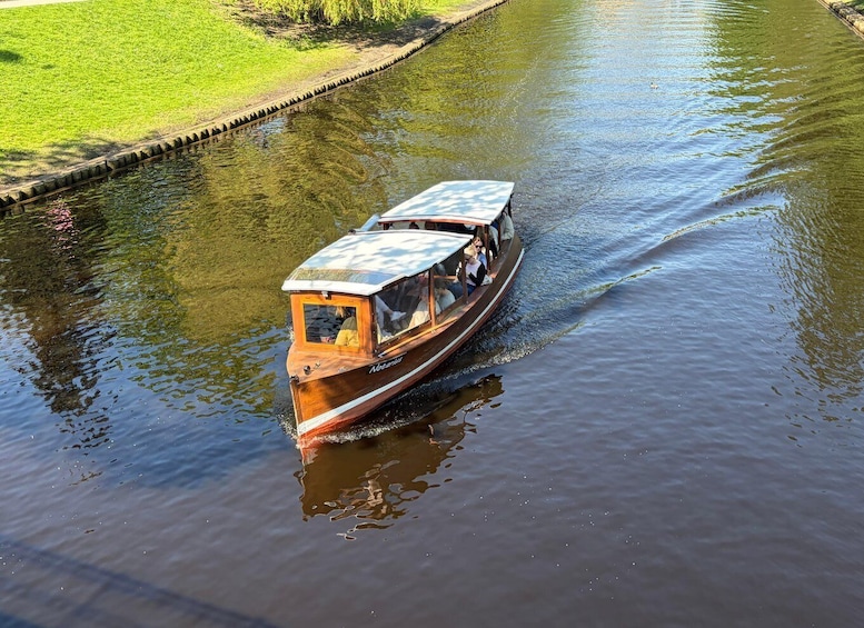 A narrowboat on a calm river. 3