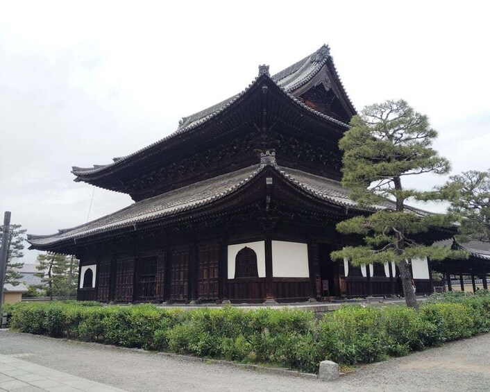A traditional Japanese building with a multi-tiered roof and wooden architecture. 2