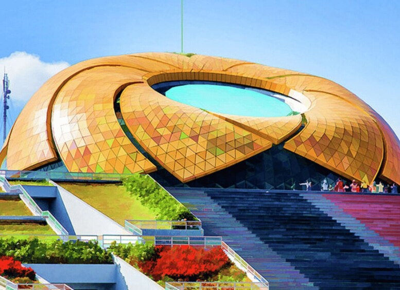 A large, uniquely shaped stadium with a golden exterior and a central blue pool. 2