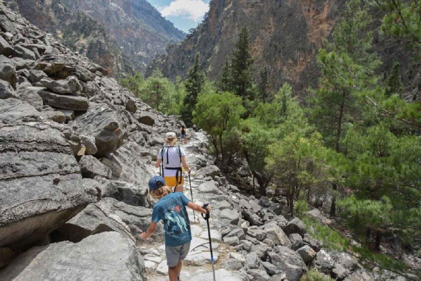 A rocky hiking trail with hikers. 4