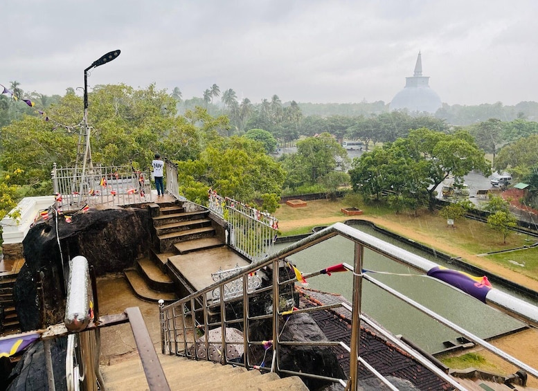 A staircase leading to a temple with a river in the foreground. 5
