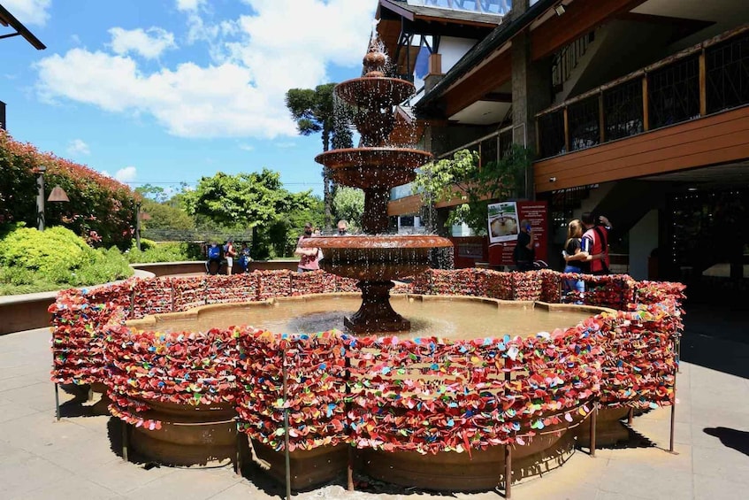 A fountain surrounded by flower-shaped decorations. 5