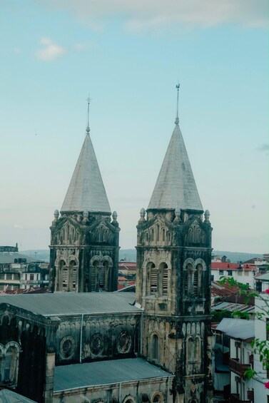 A historic church with two prominent towers and a large central dome. 5
