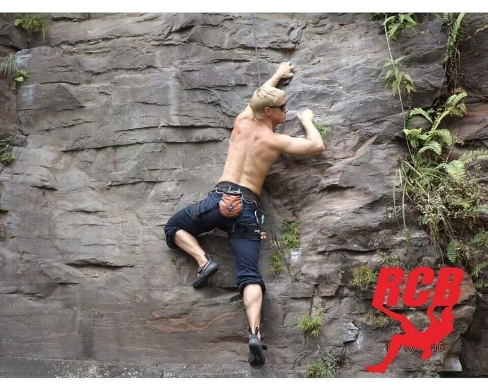 A person climbing a rock face. 3