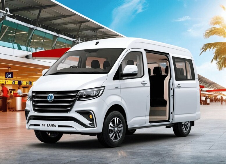 A white van with its door open, parked in an airport terminal. 5