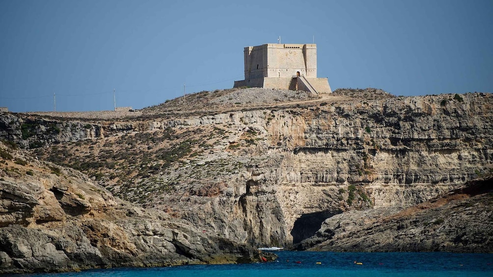 A coastal fortress on a rocky cliff overlooking the sea. 4