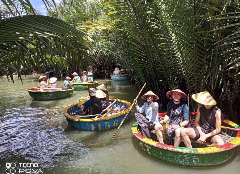 People in colorful boats on a river surrounded by palm trees. 4