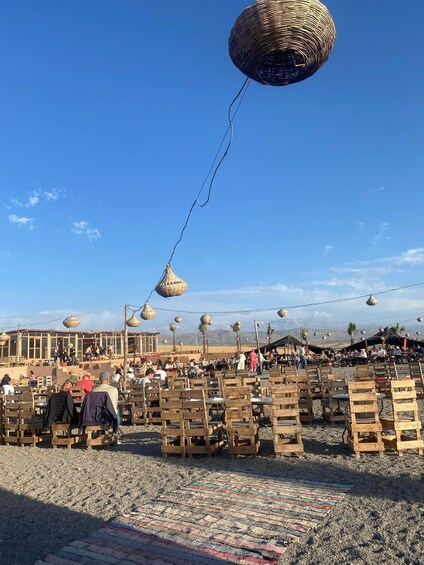 A market with wooden benches and hanging baskets. 4
