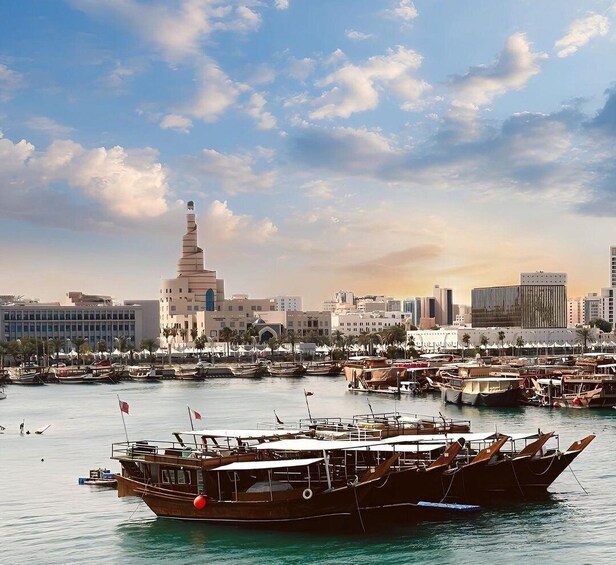A coastal cityscape with a prominent mosque, a marina filled with boats, and modern buildings in the background. 4
