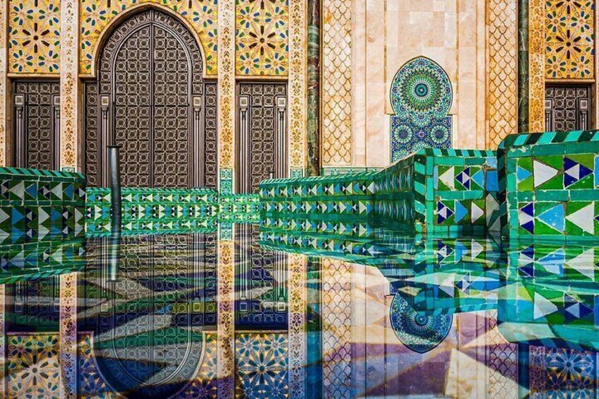 A bridge with intricate mosaic patterns, a large arched doorway, and detailed wall decorations. 4