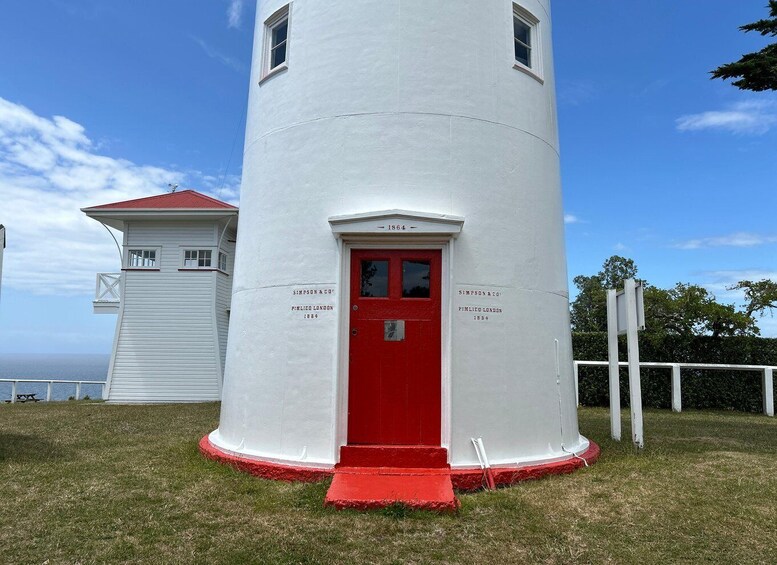 A white lighthouse with a red door, labeled 'SIMPSON & CO. PIMLICO LONDON 1864.' 3