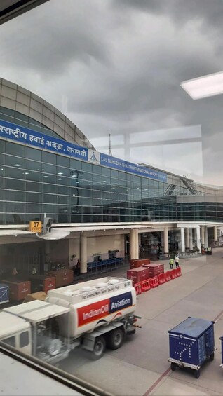 An airport terminal with a glass facade and signage in a foreign language. 4