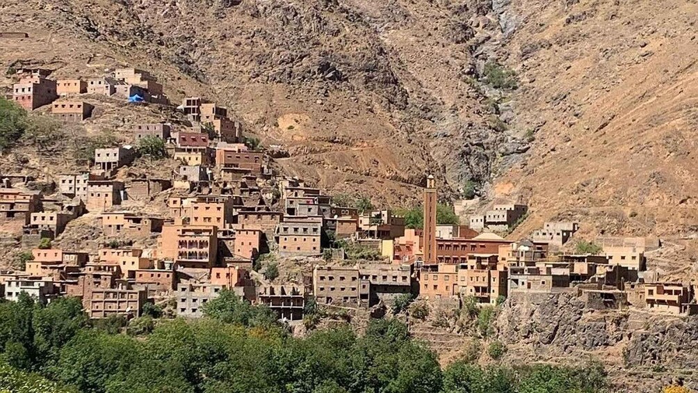 A hillside village with traditional adobe buildings. 4