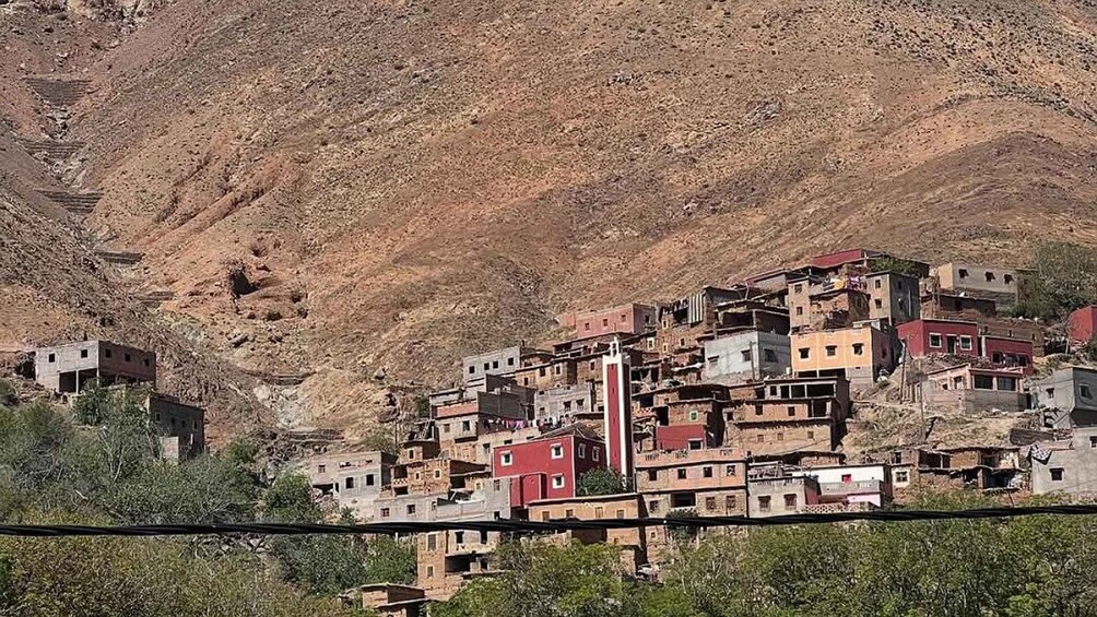 A hillside settlement with densely packed buildings. 2