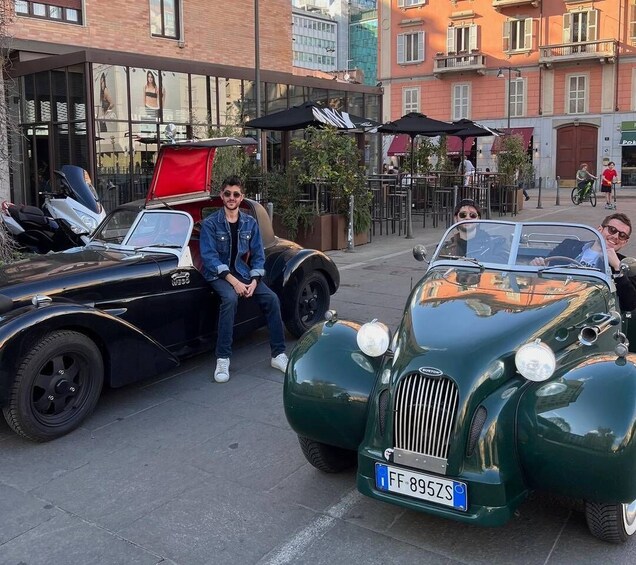 A vintage car with a license plate 'FF 895ZS' parked in an urban setting. 5