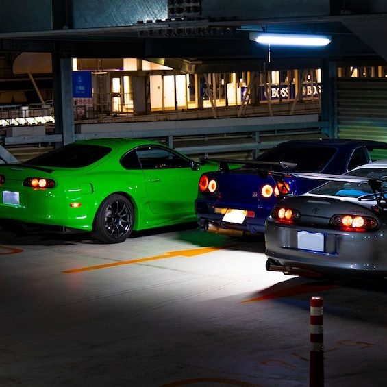 Three cars parked in a garage. 1