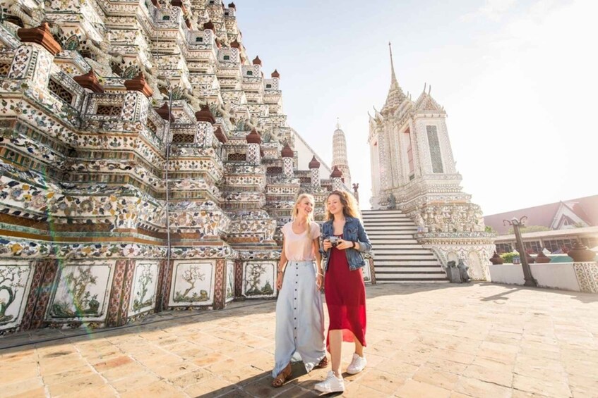 A temple with intricate tile work and a tall spire. 2