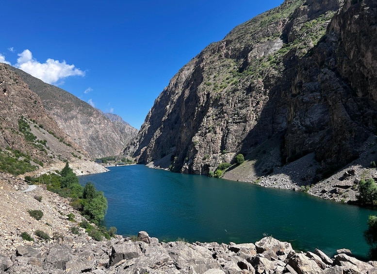 A river winding through a rocky canyon with steep cliffs and sparse vegetation. 4