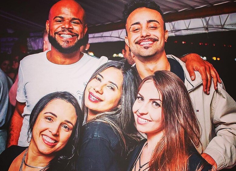A group of people posing together at an event. 5