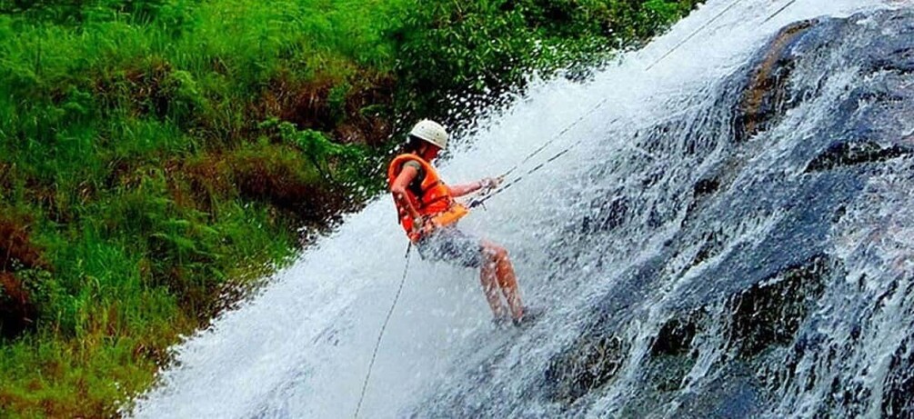 A person water skiing on a waterfall. 1
