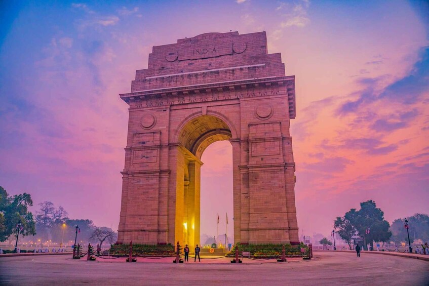 The India Gate at sunset with a clear sky. 2
