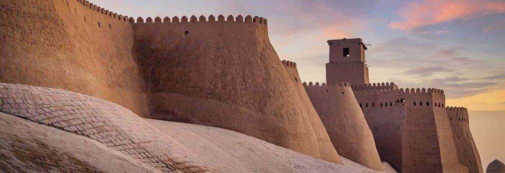 A large fortress wall with crenellations and a watchtower. 1