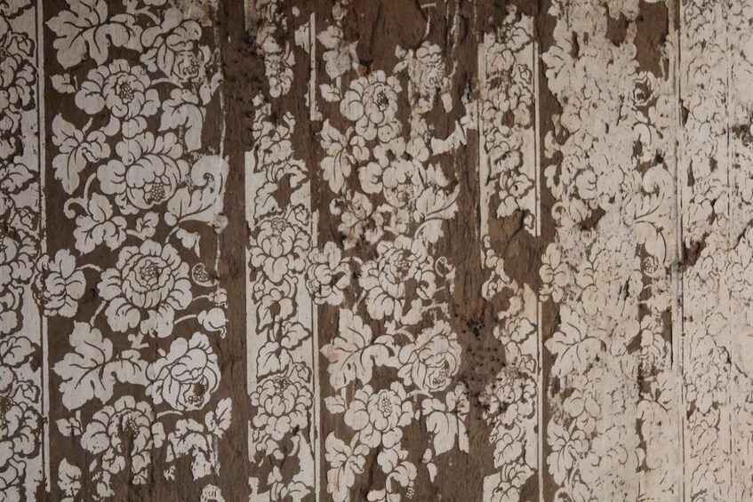 A wooden surface with intricate floral patterns. 2
