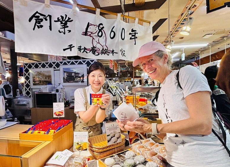 A market stall with various food items and a sign with Japanese characters. 2