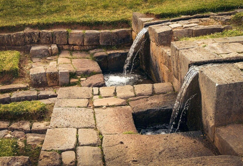 A stone watermill with two water channels. 5