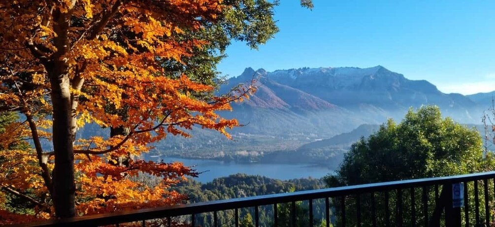 A mountain landscape with autumn foliage and a lake. 2
