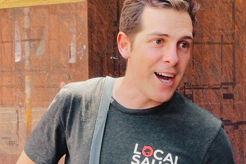 A person wearing a t-shirt with 'LOCAL SALSA' printed on it. 4