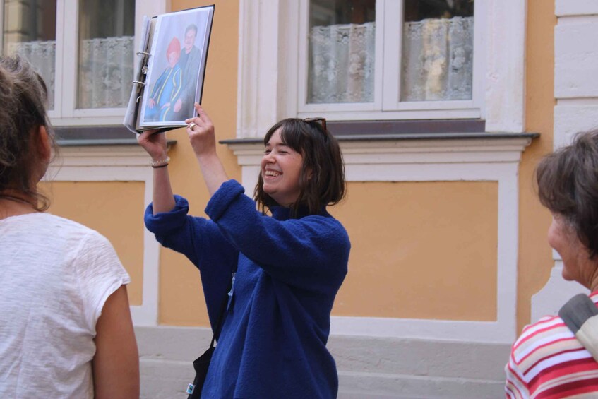 A person holding a photo album. 1