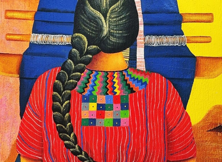 A person with a braided hairstyle, wearing a colorful patterned shirt and a red headscarf. 4