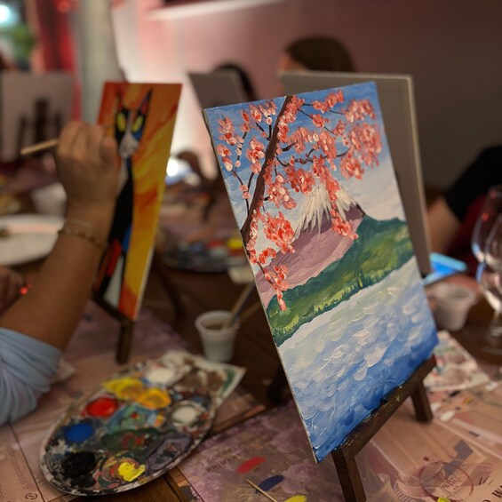 A painting of a cherry blossom tree on a canvas. 2