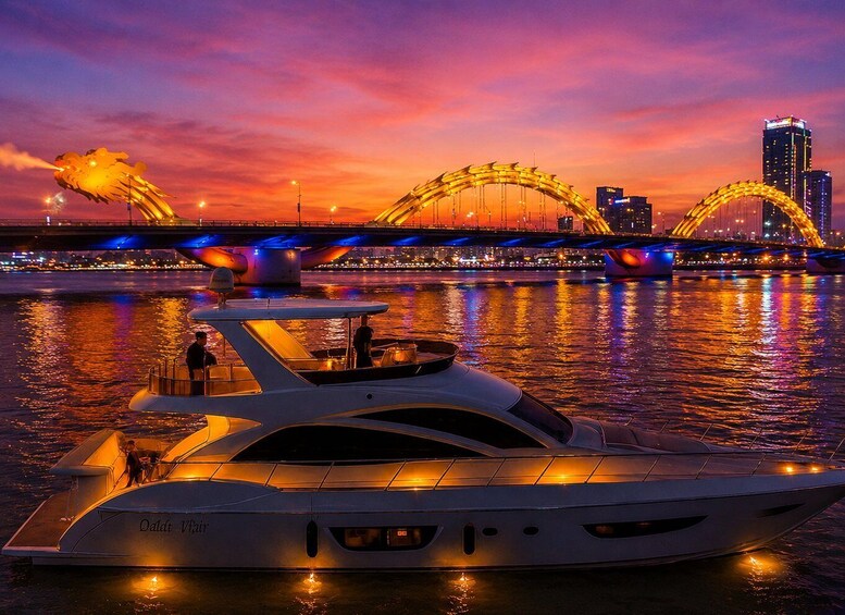 A luxury yacht docked at a marina with a city skyline and a distinctive bridge in the background. 1