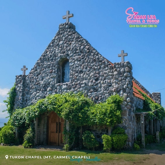 A stone chapel with crosses and ivy. 4