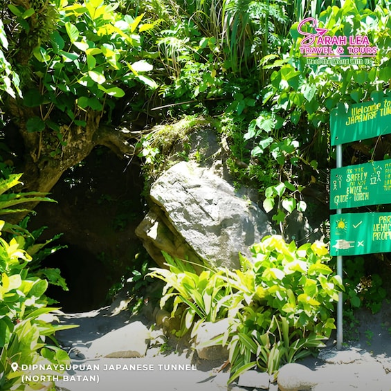 A lush green area with a sign for the Dipnaysupuan Japanese Tunnel in North Batan. 2