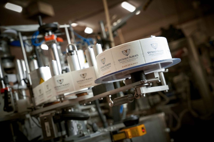 A machine with labels reading 'Vitteaut-Albert' and 'Blanc de Blancs.' 4