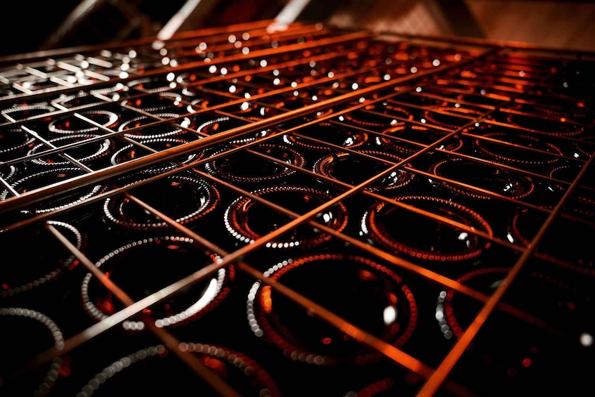 A close-up of a metallic structure with circular patterns and linear elements. 3