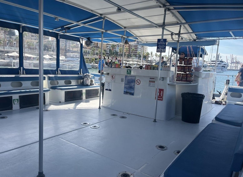 A boat deck with seating, a bar area, and a covered section. 5