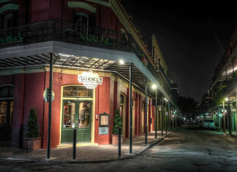 A historic building with a sign reading "Curiel's Restaurant" at night. 1