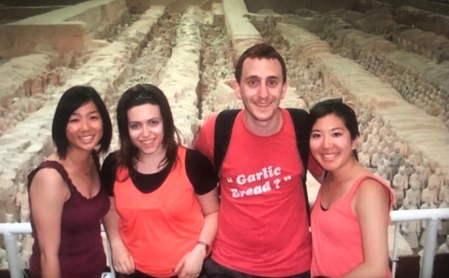 A group of people in a museum with ancient artifacts. 2