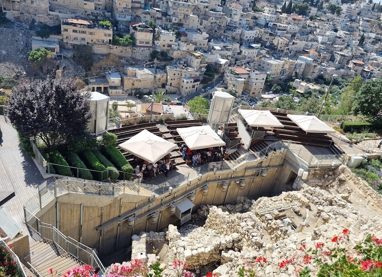 A historical site with ruins and modern buildings. 5