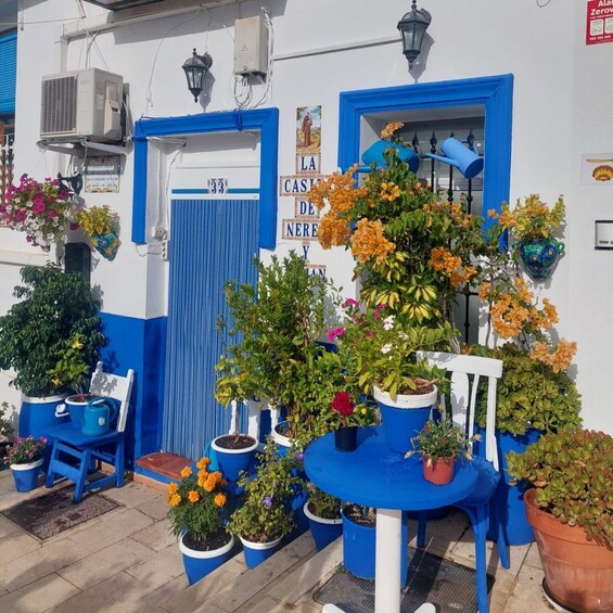A blue and white building with a sign reading "LA CASA DE NEHREY". 2