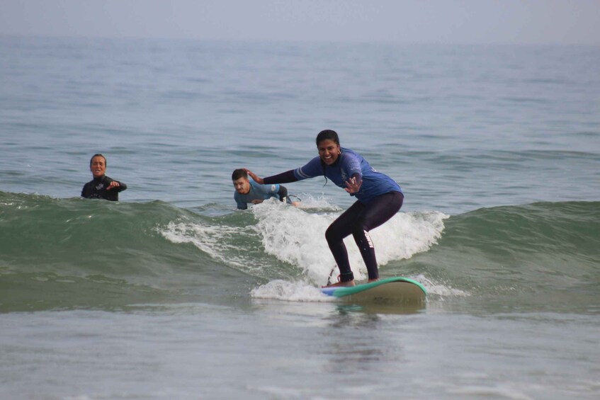 A person surfing on a wave in the ocean. 2