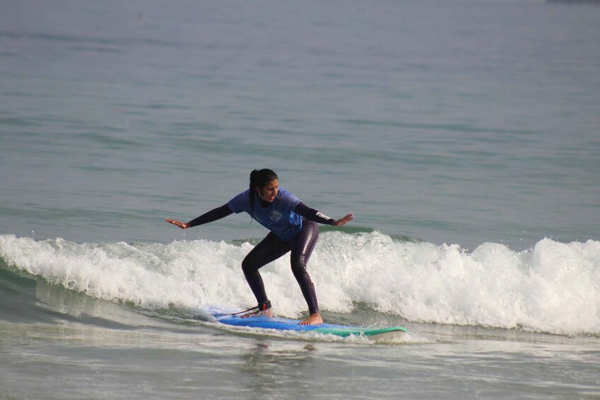 A person surfing on a wave. 3