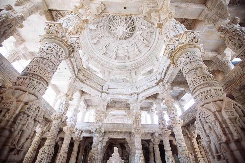 An intricately carved stone structure with detailed artwork and columns. 1