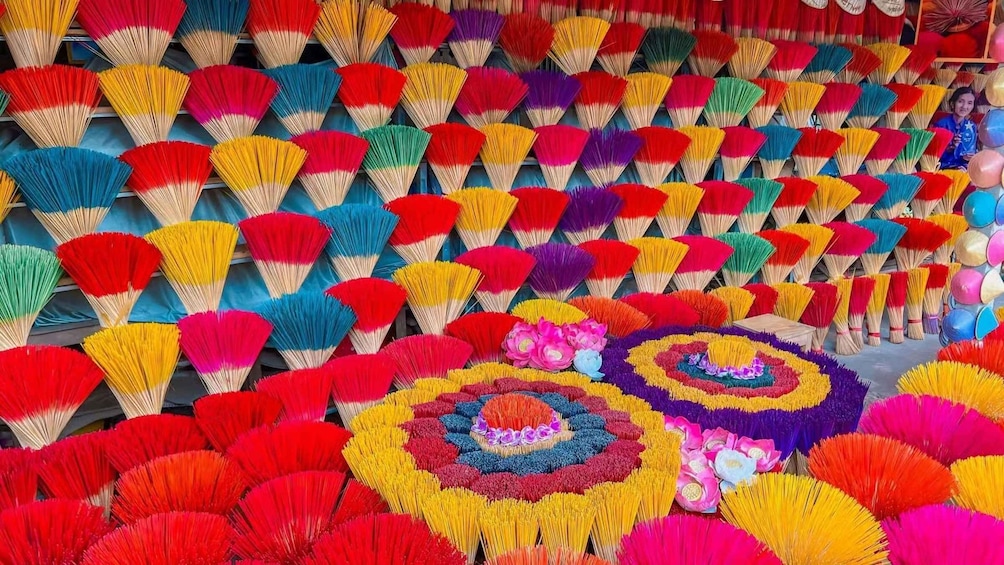 A display of colorful fans with intricate designs. 4