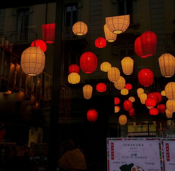 Red and yellow paper lanterns hanging in a street. 5